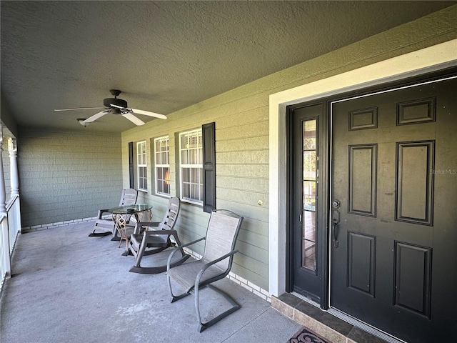 doorway to property with ceiling fan