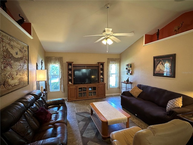 living room featuring tile patterned flooring, lofted ceiling, and ceiling fan