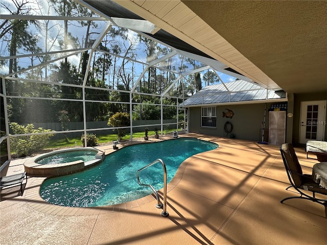 view of pool featuring an in ground hot tub, a patio area, and a lanai