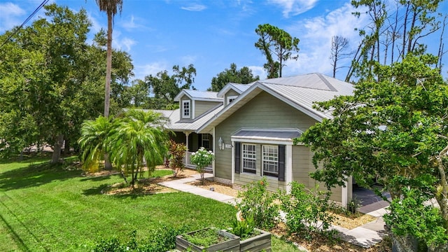 rear view of house with a yard