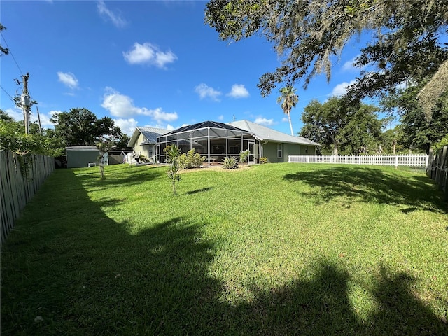 view of yard with glass enclosure