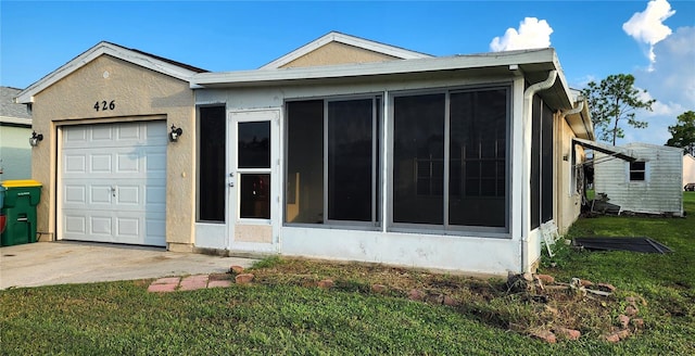 ranch-style home with a front yard and a garage