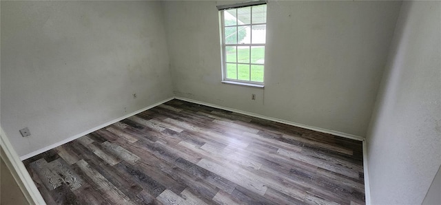 empty room featuring dark wood-type flooring