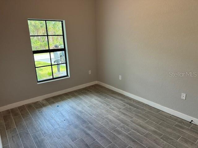 empty room featuring hardwood / wood-style floors