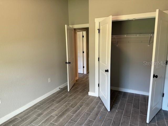 unfurnished bedroom with a closet