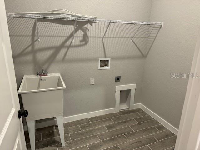 washroom with washer hookup and electric dryer hookup