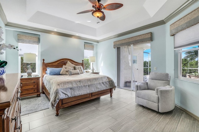 bedroom with access to outside, a raised ceiling, and ceiling fan