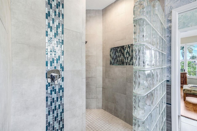 bathroom with tiled shower