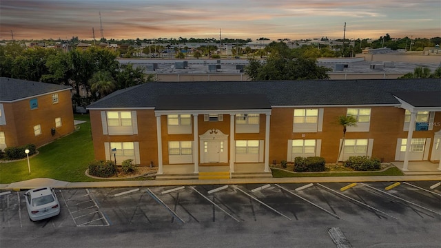 view of outdoor building at dusk