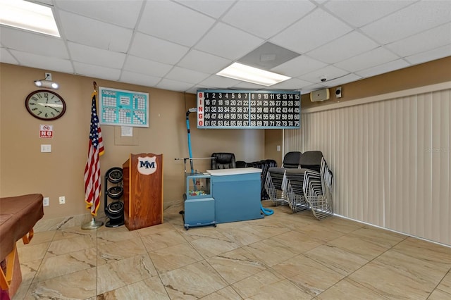 finished basement with a paneled ceiling