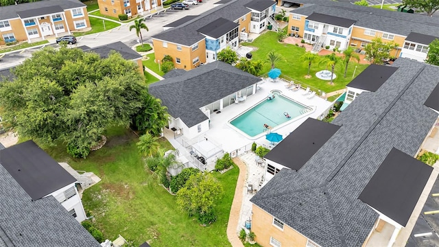 birds eye view of property with a residential view