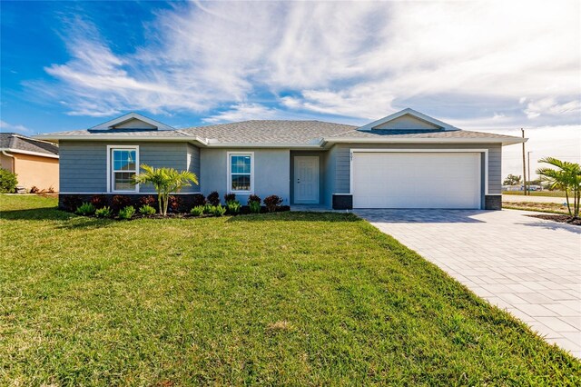 ranch-style home with a garage and a front yard