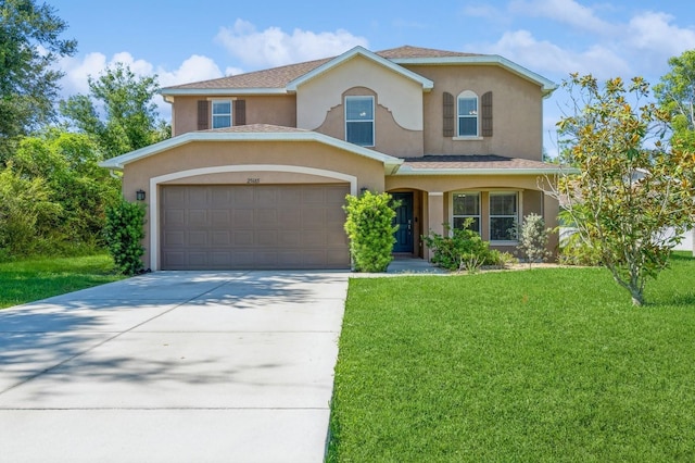 view of front of property featuring a garage and a front lawn