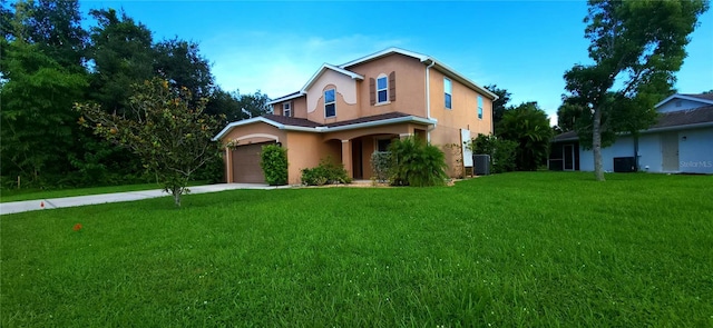 view of front of property with a garage and a front yard