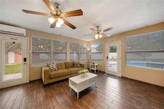 sunroom / solarium featuring a wall mounted air conditioner and ceiling fan