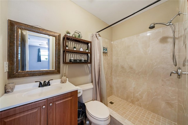 bathroom featuring walk in shower, toilet, and vanity