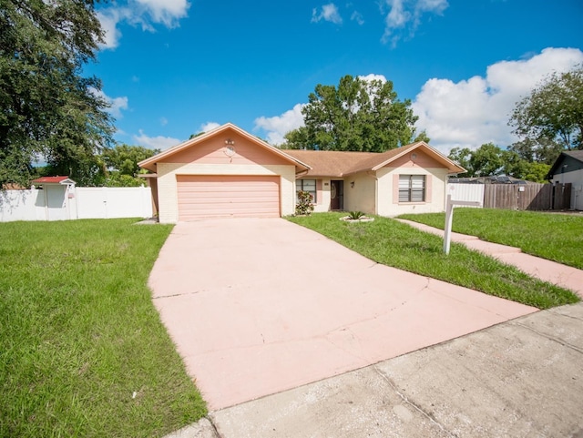 single story home with a garage and a front yard