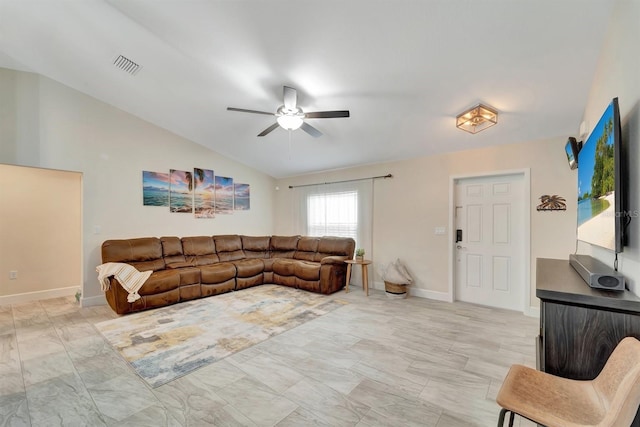 tiled living room featuring ceiling fan and vaulted ceiling