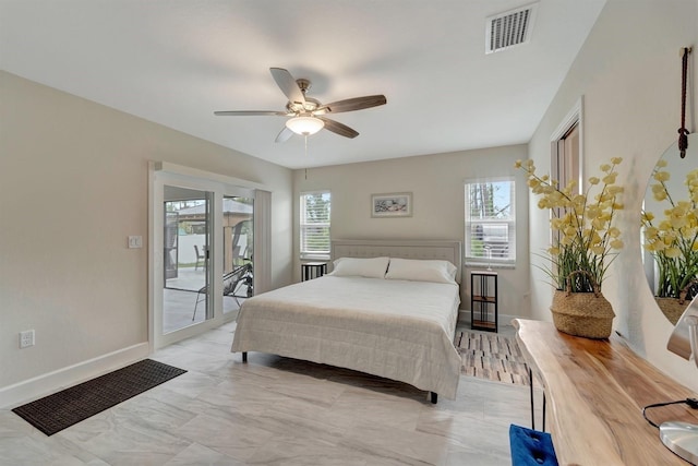 bedroom featuring access to exterior, ceiling fan, and light tile patterned floors