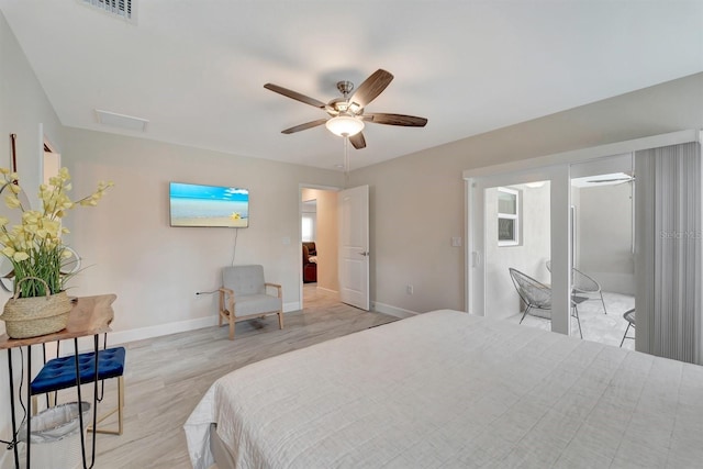 bedroom featuring light hardwood / wood-style floors and ceiling fan