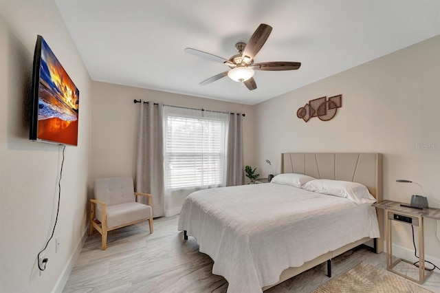 bedroom with light wood-type flooring and ceiling fan