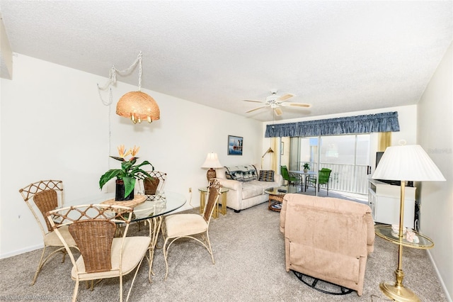 living room featuring light colored carpet, a textured ceiling, and ceiling fan