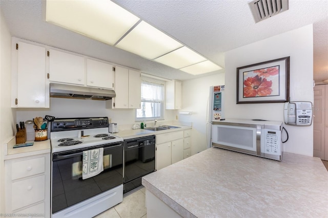 kitchen with a textured ceiling, white appliances, sink, white cabinetry, and light tile patterned flooring