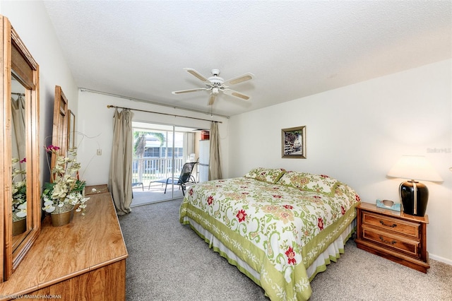 carpeted bedroom featuring ceiling fan, access to exterior, and a textured ceiling