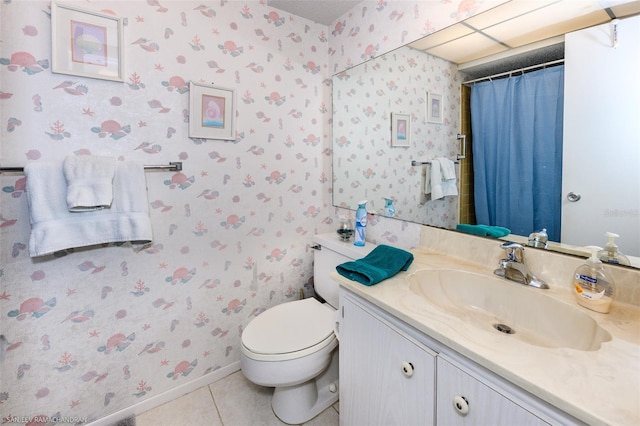 bathroom featuring vanity, toilet, and tile patterned floors