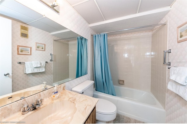 full bathroom featuring vanity, toilet, and shower / tub combo