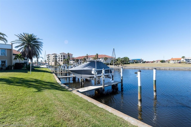 view of dock featuring a water view and a lawn