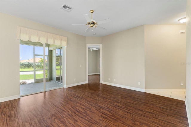 empty room with hardwood / wood-style flooring and ceiling fan