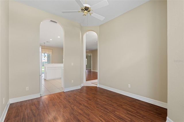 spare room featuring ceiling fan and light hardwood / wood-style flooring