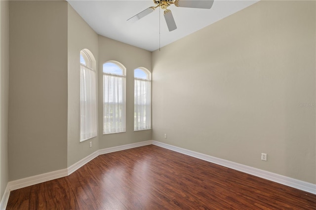 unfurnished room with ceiling fan and wood-type flooring