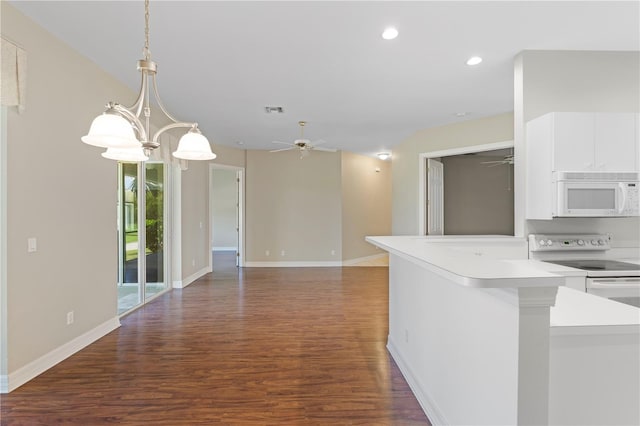 kitchen with ceiling fan with notable chandelier, pendant lighting, white cabinetry, dark hardwood / wood-style flooring, and white appliances