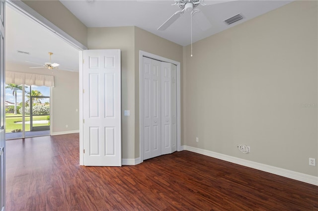 unfurnished bedroom featuring wood-type flooring, ceiling fan, and a closet