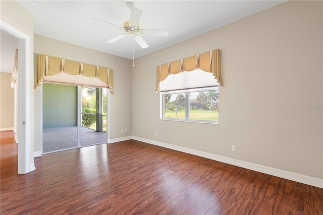 unfurnished room featuring ceiling fan and dark hardwood / wood-style floors