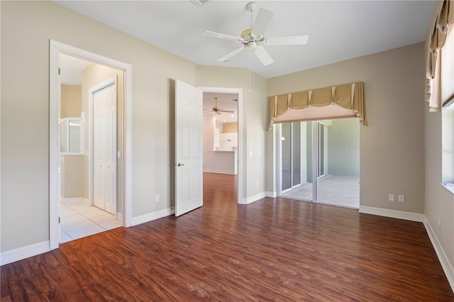 empty room featuring ceiling fan and light wood-type flooring