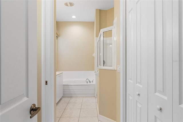 bathroom featuring plus walk in shower and tile patterned floors