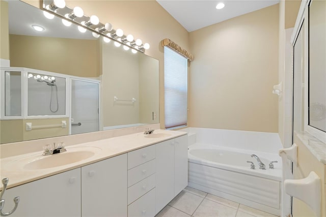 bathroom with tile patterned flooring, vanity, and independent shower and bath