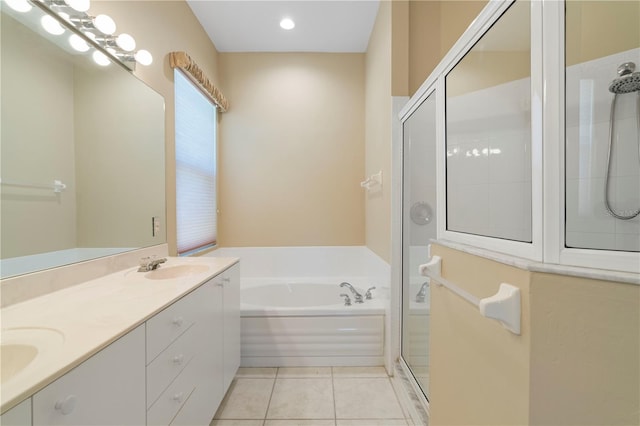 bathroom with tile patterned floors, plus walk in shower, and vanity