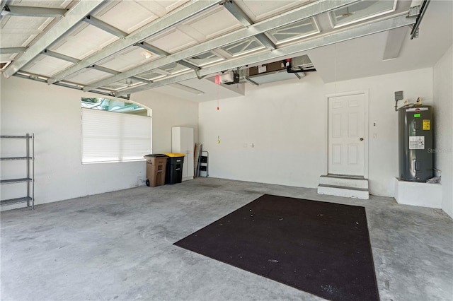 garage with a garage door opener and water heater