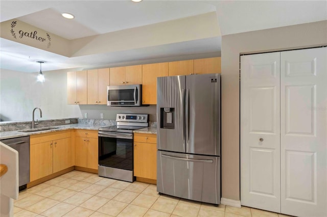 kitchen featuring light tile patterned floors, recessed lighting, a sink, appliances with stainless steel finishes, and light brown cabinetry