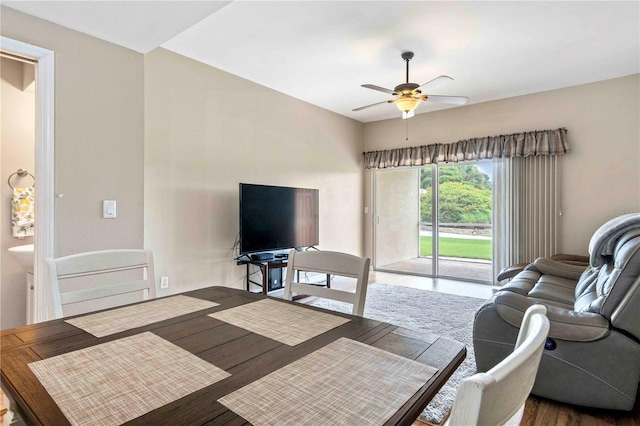 living room with ceiling fan and wood finished floors