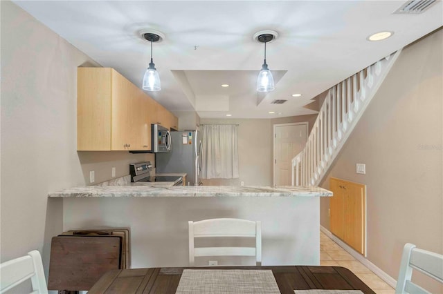 kitchen featuring visible vents, appliances with stainless steel finishes, light stone counters, a peninsula, and light brown cabinetry