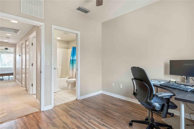 office space featuring hardwood / wood-style flooring and ceiling fan