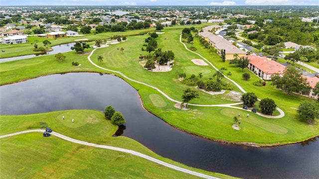 aerial view featuring view of golf course and a water view