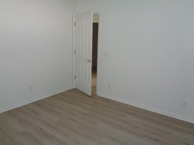 spare room featuring light hardwood / wood-style flooring