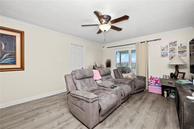 living room with light hardwood / wood-style flooring, ceiling fan, and crown molding