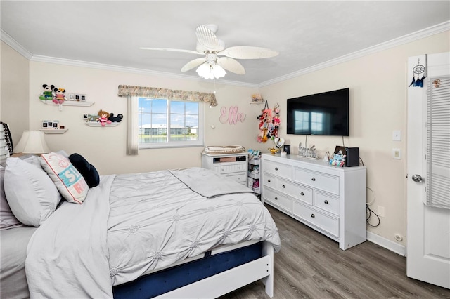 bedroom featuring wood-type flooring, ceiling fan, and crown molding